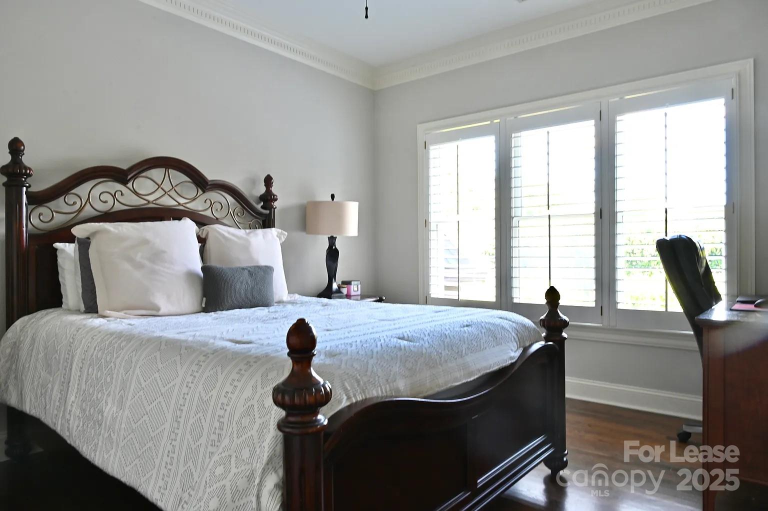 17234 Jetton Road Cornelius, NC 28031 - Photo 25 of 32 a bedroom with bed and windows