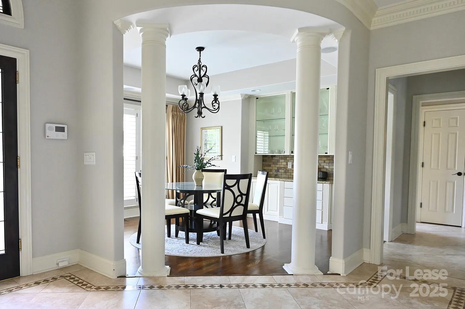 17234 Jetton Road Cornelius, NC 28031 - Photo 8 of 32 a view of a dining room with furniture and wooden floor