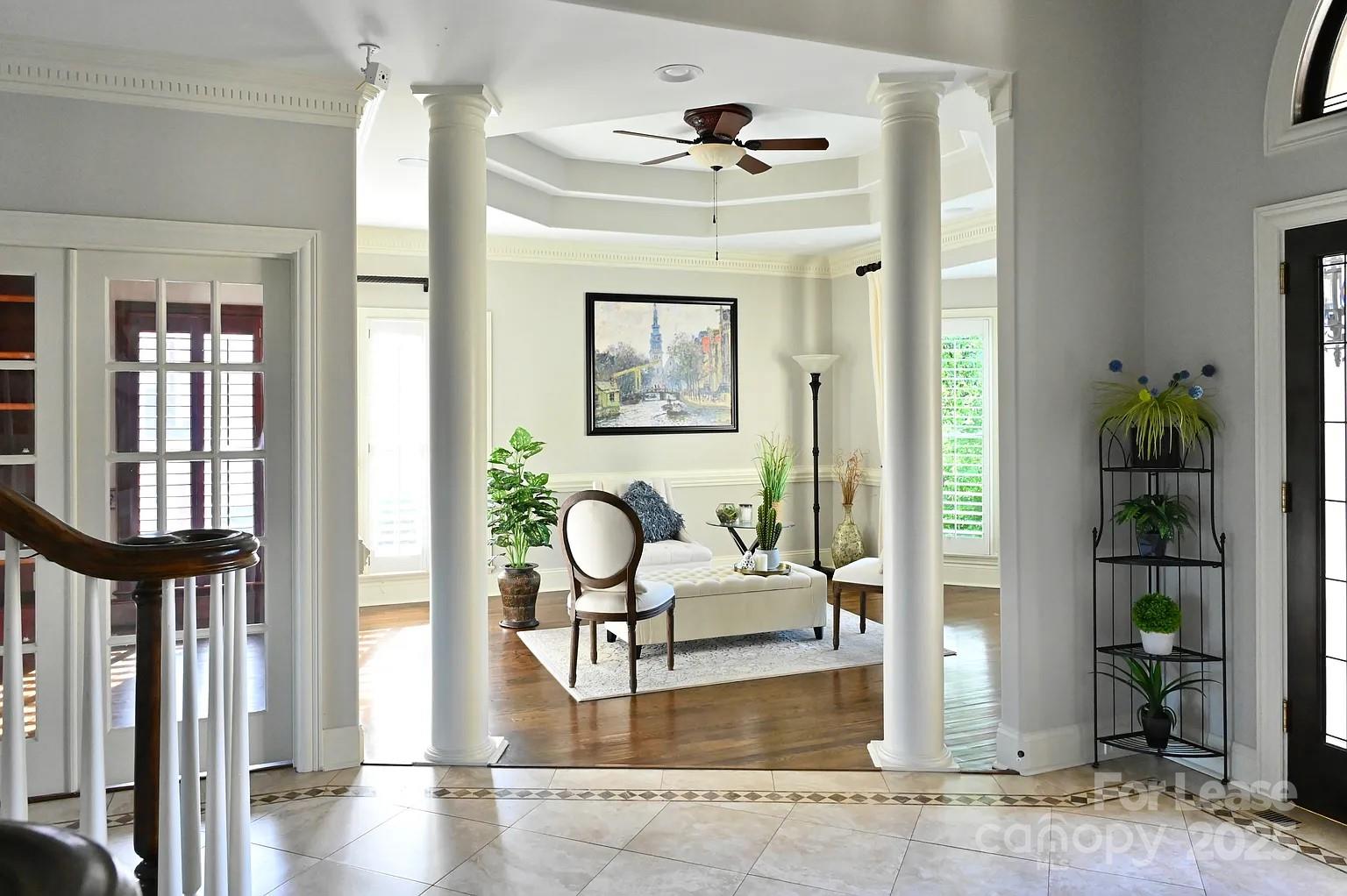 17234 Jetton Road Cornelius, NC 28031 - Photo 10 of 32 a living room with furniture a window and a fireplace
