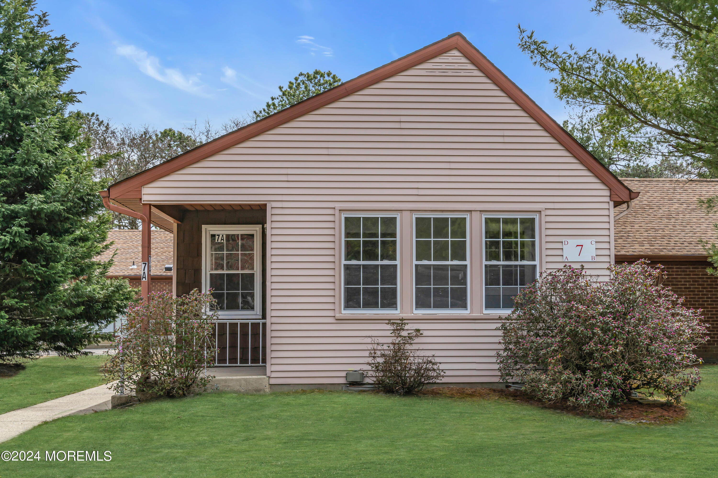 7 A Spring Street, Unit 50 Whiting, NJ 08759 - Photo 1 of 16 a view of a house with a yard