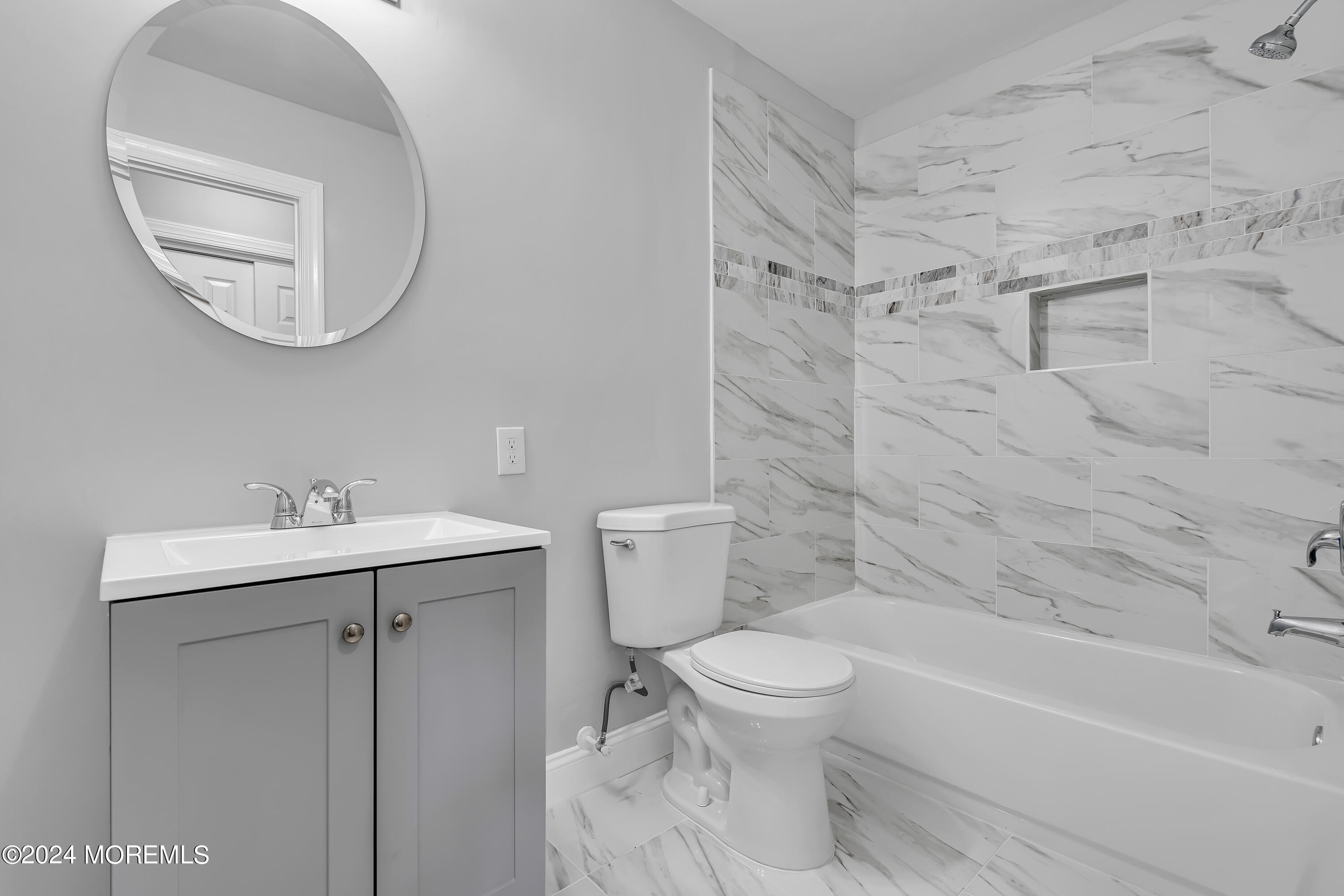 7 A Spring Street, Unit 50 Whiting, NJ 08759 - Photo 12 of 16 a bathroom with a sink toilet and shower