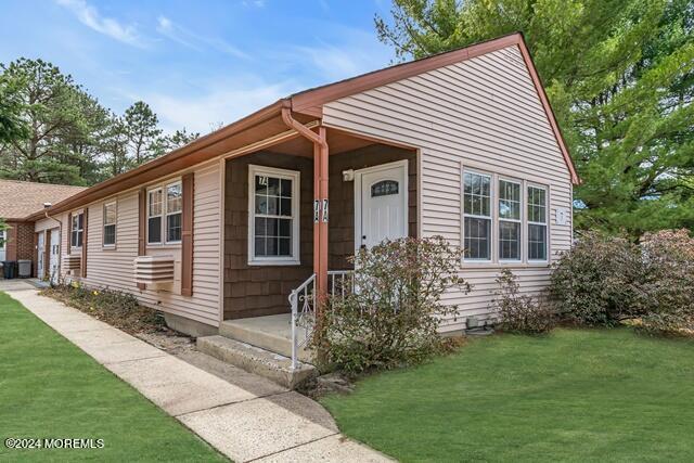 7 A Spring Street, Unit 50 Whiting, NJ 08759 - Photo 2 of 16 a front view of a house with a yard