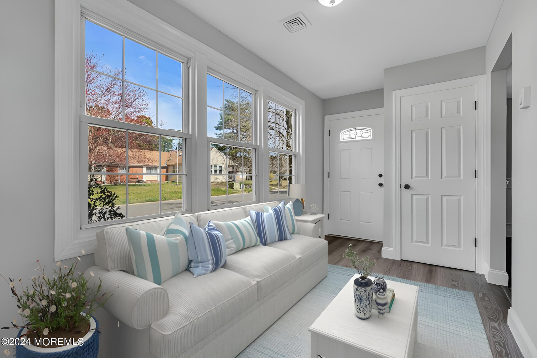 7 A Spring Street, Unit 50 Whiting, NJ 08759 - Photo 3 of 16 a living room with furniture and a large window