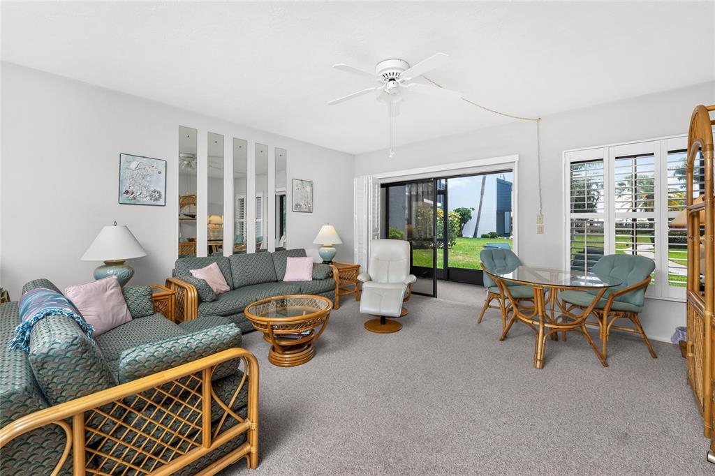 2955 North Beach Road, Unit B614 Englewood, FL 34223 - Photo 9 of 67 a living room with furniture and a large window