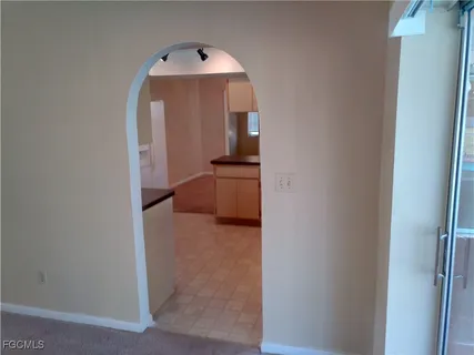 a kitchen with a sink and large cabinets
