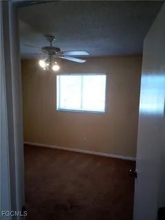 an empty room that has a mirror