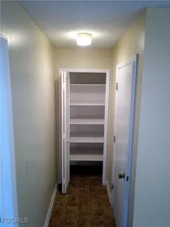 a view of a room with empty racks on the wall