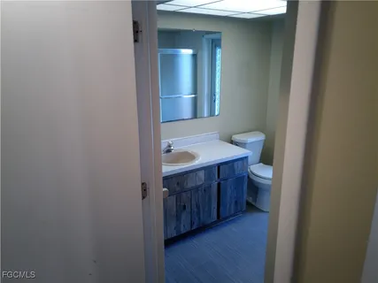 an empty room with a empty space and windows