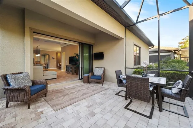 a outdoor space with patio the couches and a potted plant on the table