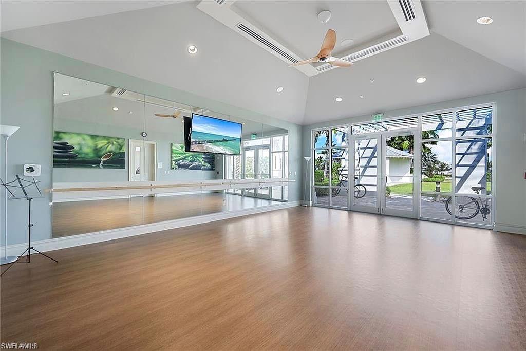 9418 Greyhawk Trail Naples, FL 34120 - Photo 34 of 34 a view of an entryway with wooden floor