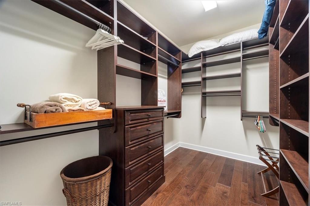 9418 Greyhawk Trail Naples, FL 34120 - Photo 10 of 34 a view of walk in closet with clothes and shoes