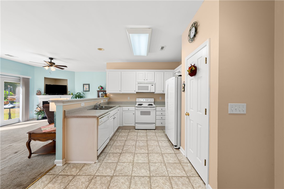 105 Ledgewood Way Easley, SC 29642 - Photo 11 of 33 This open concept kitchen offers ample counter space, seamlessly connecting to the living area.