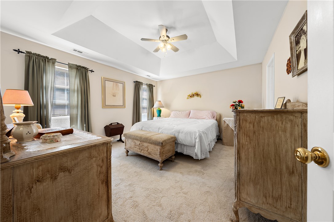 105 Ledgewood Way Easley, SC 29642 - Photo 16 of 33 This serene bedroom offers a comfortable retreat with a beautiful tray ceiling.