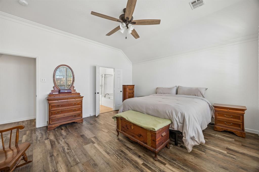 5 Cimarron Court Trophy Club, TX 76262 - Photo 11 of 30 a bedroom with a bed and a dresser