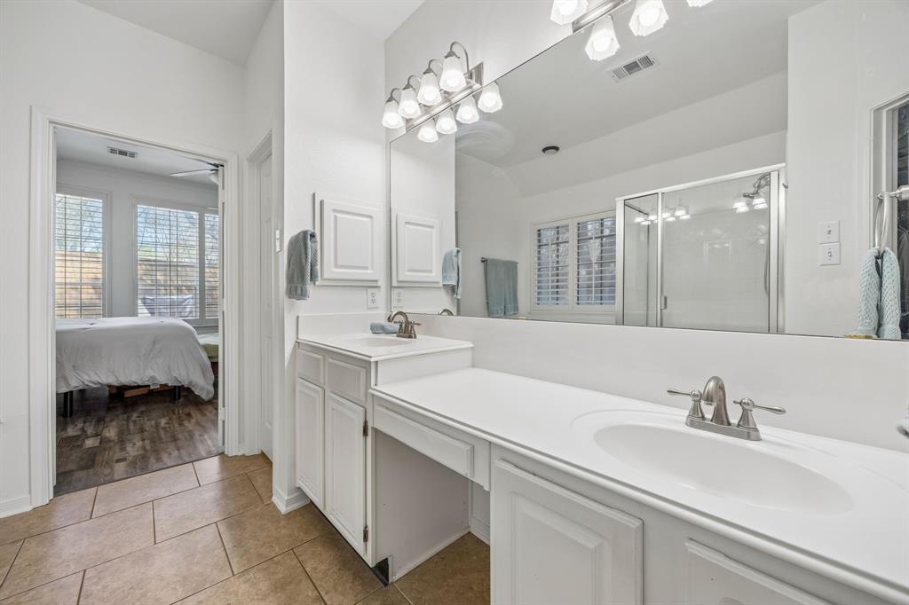 5 Cimarron Court Trophy Club, TX 76262 - Photo 14 of 30 a en suite bathroom with a sink double vanity and a mirror