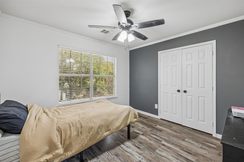5 Cimarron Court Trophy Club, TX 76262 - Photo 25 of 30 a bedroom with a bed and a window