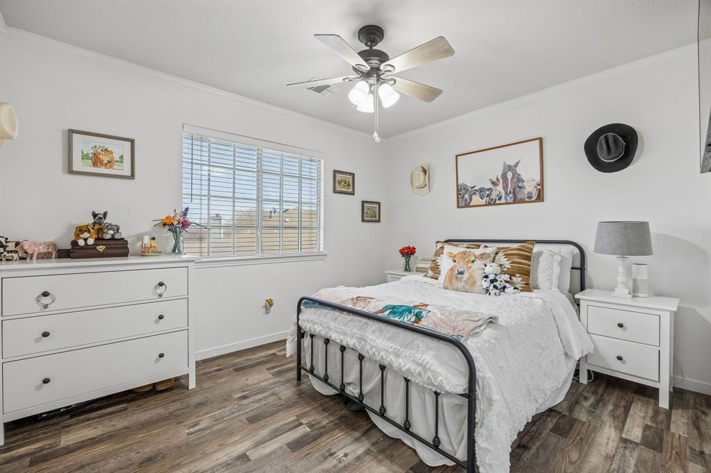 5 Cimarron Court Trophy Club, TX 76262 - Photo 27 of 30 a bedroom with a large bed and a window