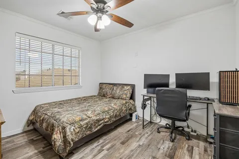 a bedroom with a bed and a chair