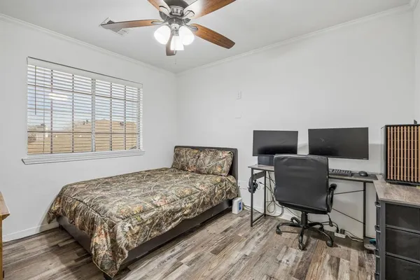 a bedroom with a bed and a chair