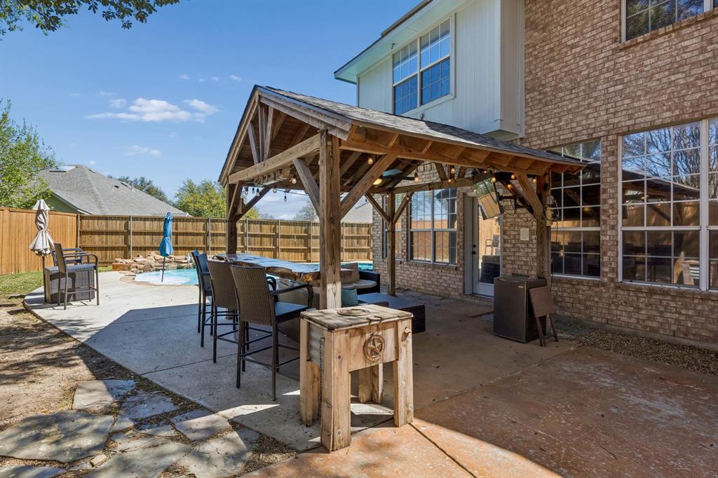 5 Cimarron Court Trophy Club, TX 76262 - Photo 30 of 30 a view of a chairs and table in patio