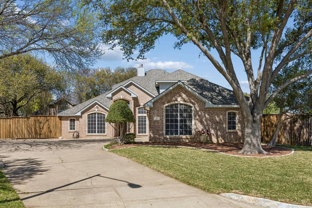5 Cimarron Court Trophy Club, TX 76262 - Photo 4 of 30 a front view of a house with a yard