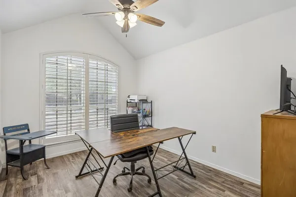 a workspace with furniture and a window