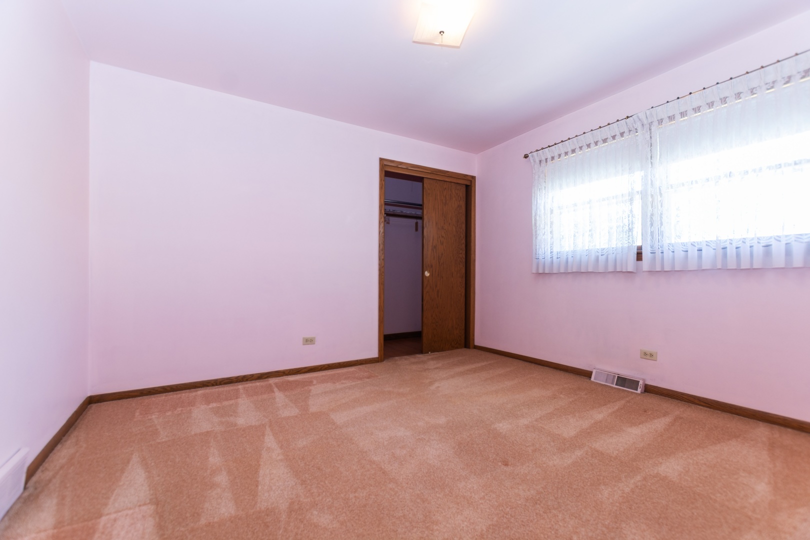 10621 Princess Avenue Chicago Ridge, IL 60415 - Photo 6 of 13 an empty room with a window