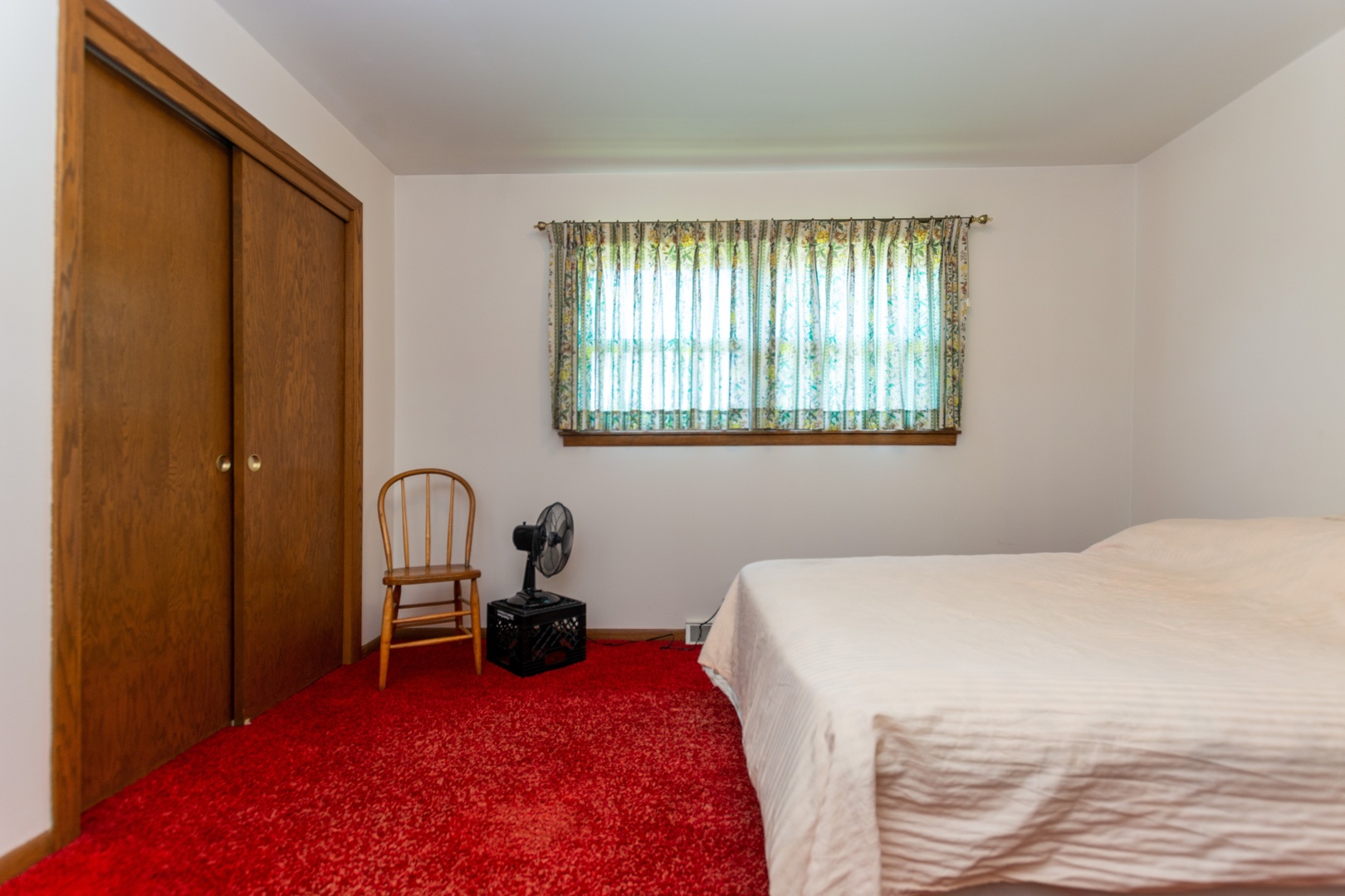 10621 Princess Avenue Chicago Ridge, IL 60415 - Photo 8 of 13 a bedroom with a bed and a large window