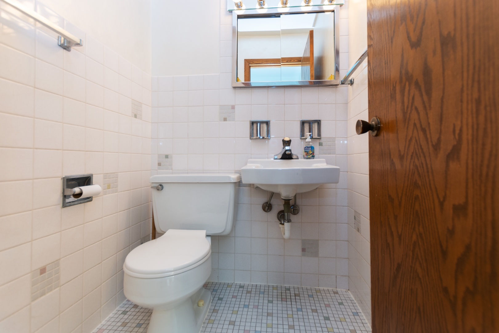 10621 Princess Avenue Chicago Ridge, IL 60415 - Photo 10 of 13 a bathroom with a sink toilet and a mirror