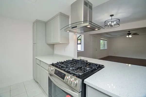 a kitchen with a stove and a sink