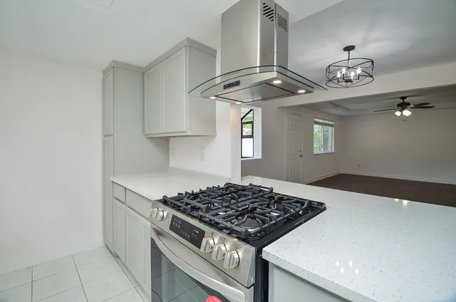 a kitchen with a stove and a sink