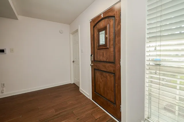 a view of entryway with wooden floor