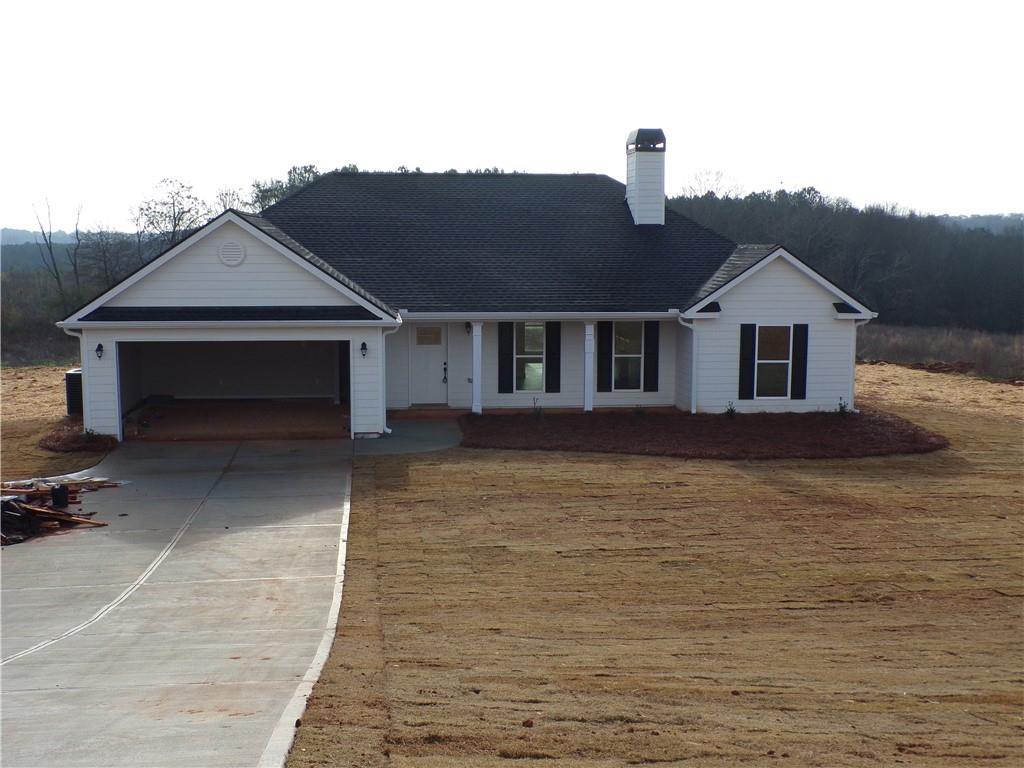 1042 Anderson Thomas Road Martin, GA 30557 - Photo 1 of 1 a front view of a house with a yard