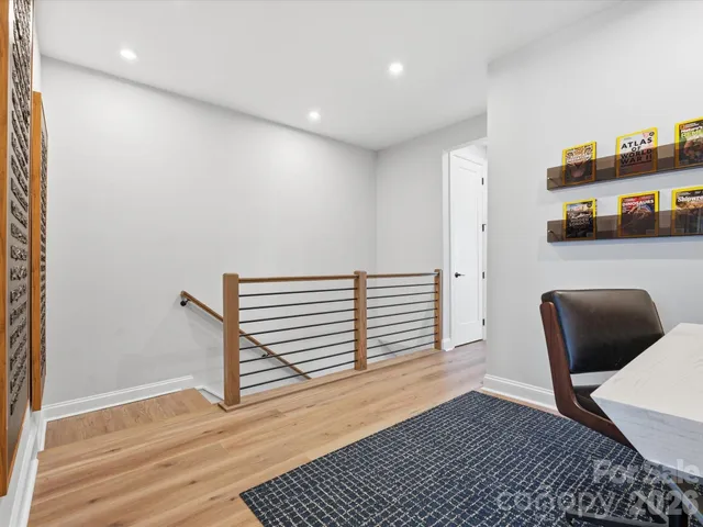 a bedroom with a bed dresser and a window