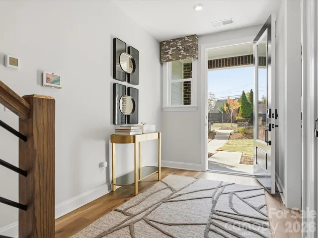 a spacious bedroom with a bed and a large window