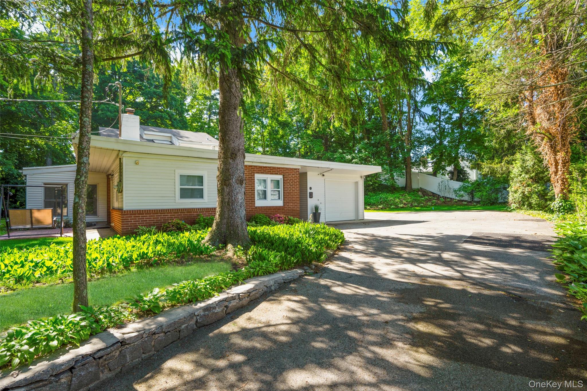 A sweeping, tree-lined driveway welcomes you to your private oasis.