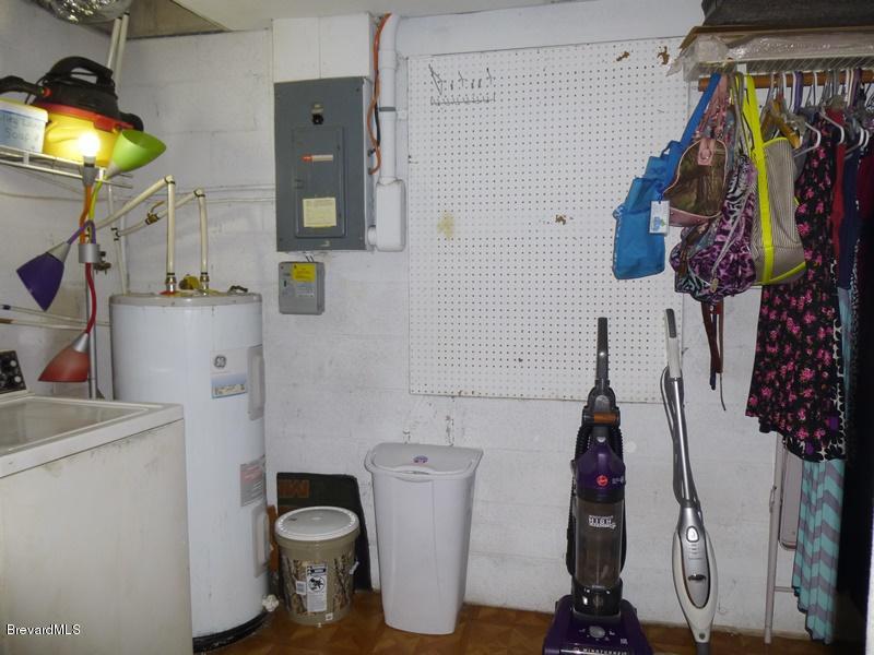 283 Lee Road Melbourne, FL 32904 - Photo 24 of 28 closet & laundry room off garage room