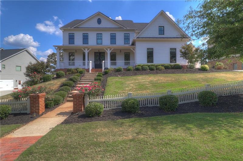 Stunning home in Williams Point Community, with picket fences lining its streets!