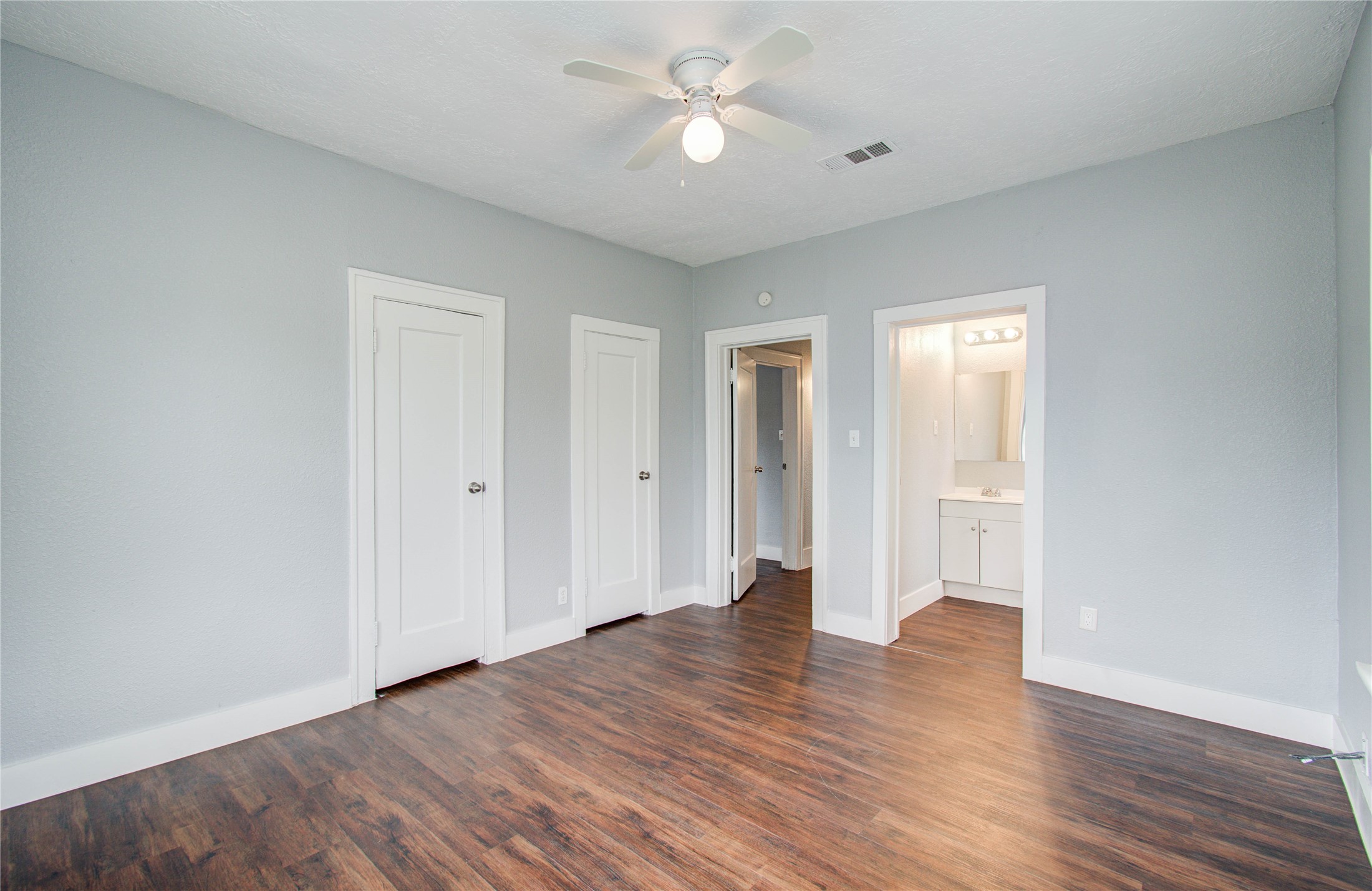 3824 Topping Street Houston, TX 77093 - Photo 23 of 31 wooden floor in an empty room with a window