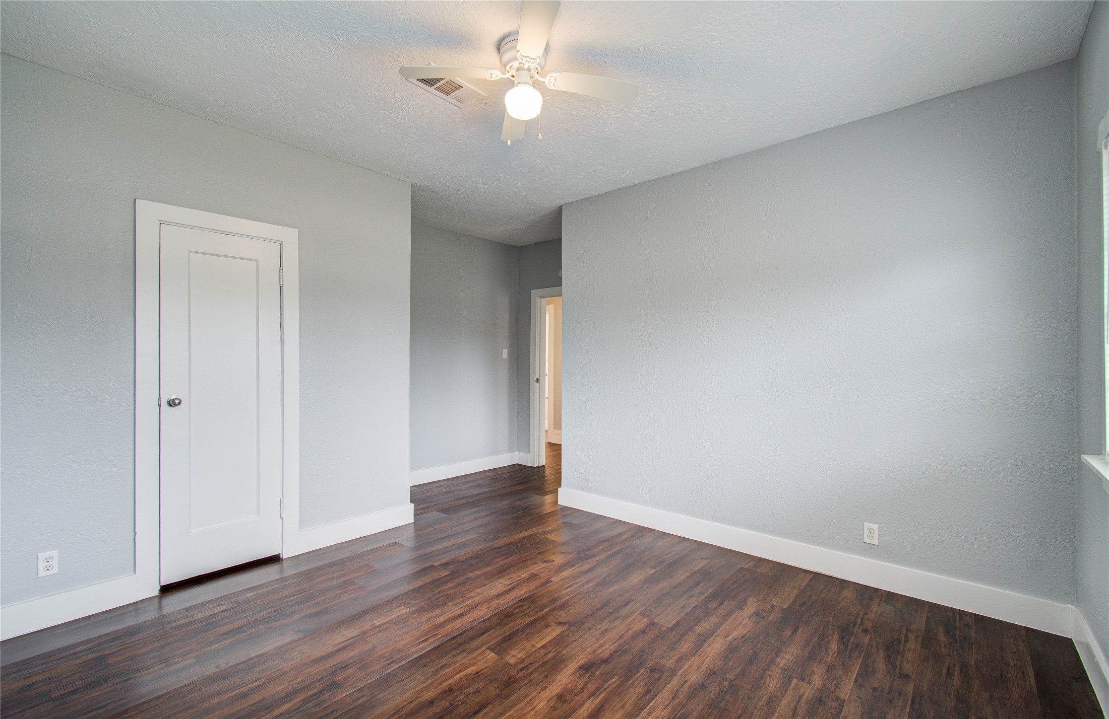 3824 Topping Street Houston, TX 77093 - Photo 27 of 31 a view of an empty room with wooden floor