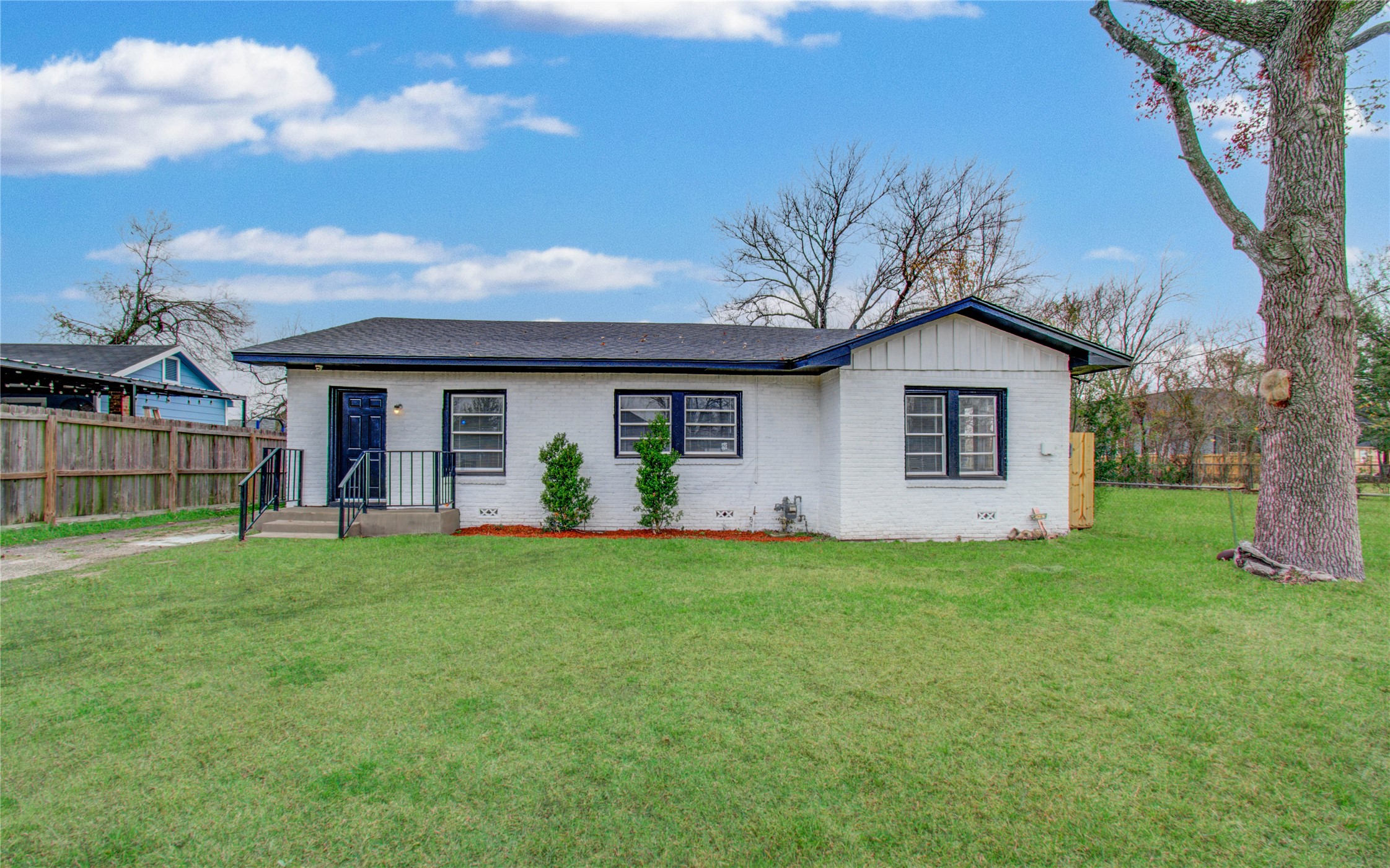 3824 Topping Street Houston, TX 77093 - Photo 4 of 31 a front view of a house with a garden and yard