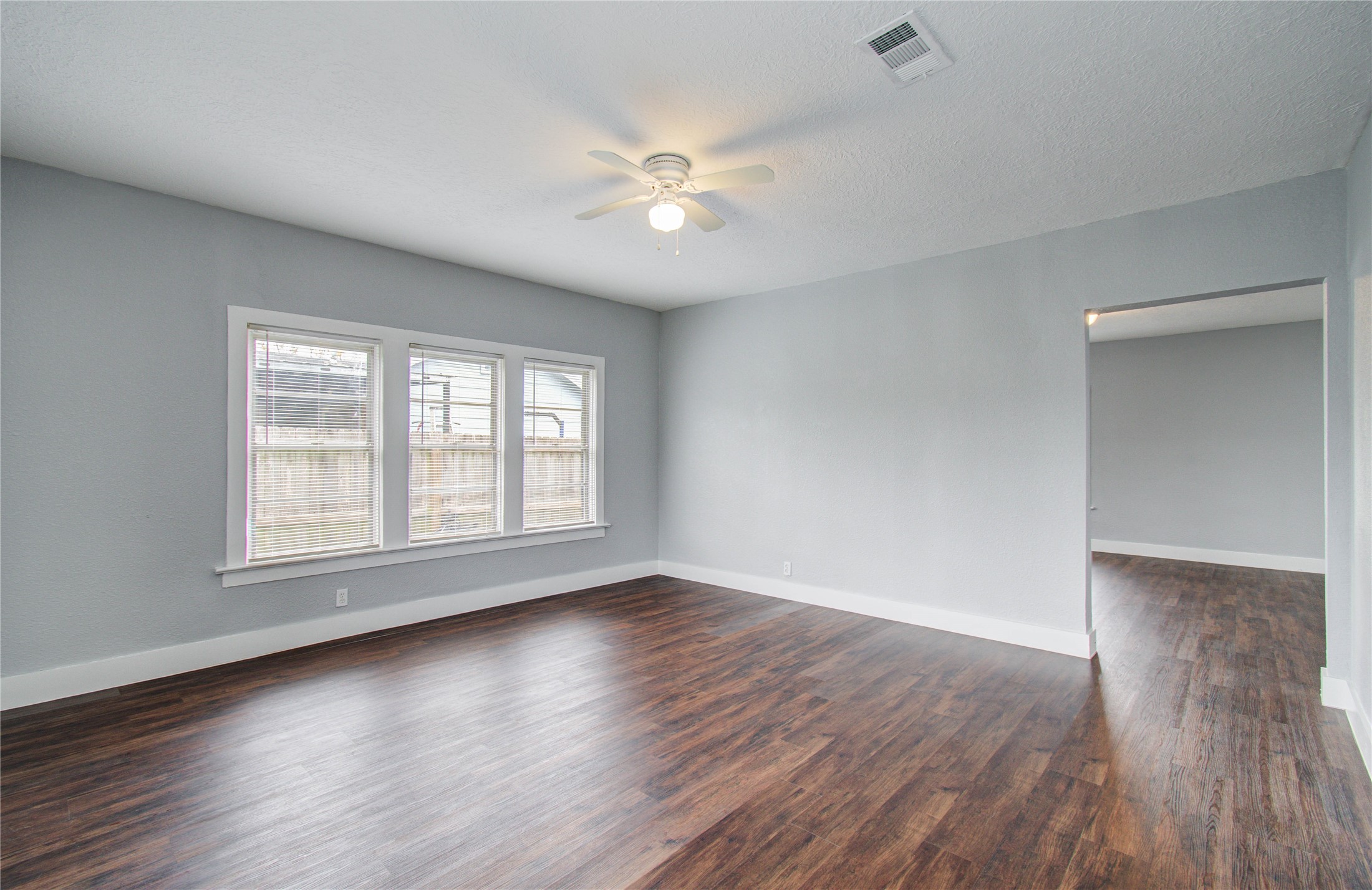 3824 Topping Street Houston, TX 77093 - Photo 10 of 31 wooden floor in an empty room with a window