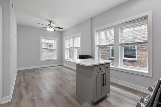 a view of cabinet and wooden floor in a room