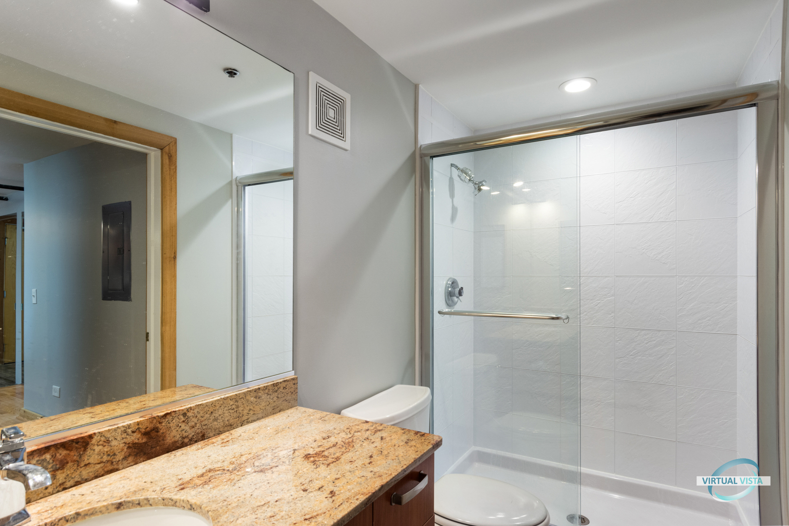 732 South Financial Place, Unit 104 Chicago, IL 60605 - Photo 12 of 30 a bathroom with a granite countertop sink toilet and shower