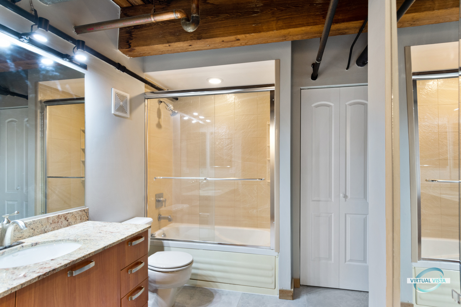 732 South Financial Place, Unit 104 Chicago, IL 60605 - Photo 19 of 30 a bathroom with a granite countertop sink toilet and shower