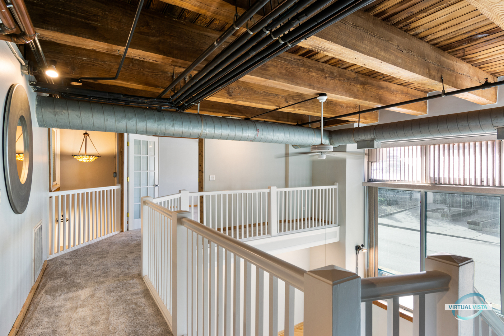 732 South Financial Place, Unit 104 Chicago, IL 60605 - Photo 10 of 30 a view of staircase with railing and white walls