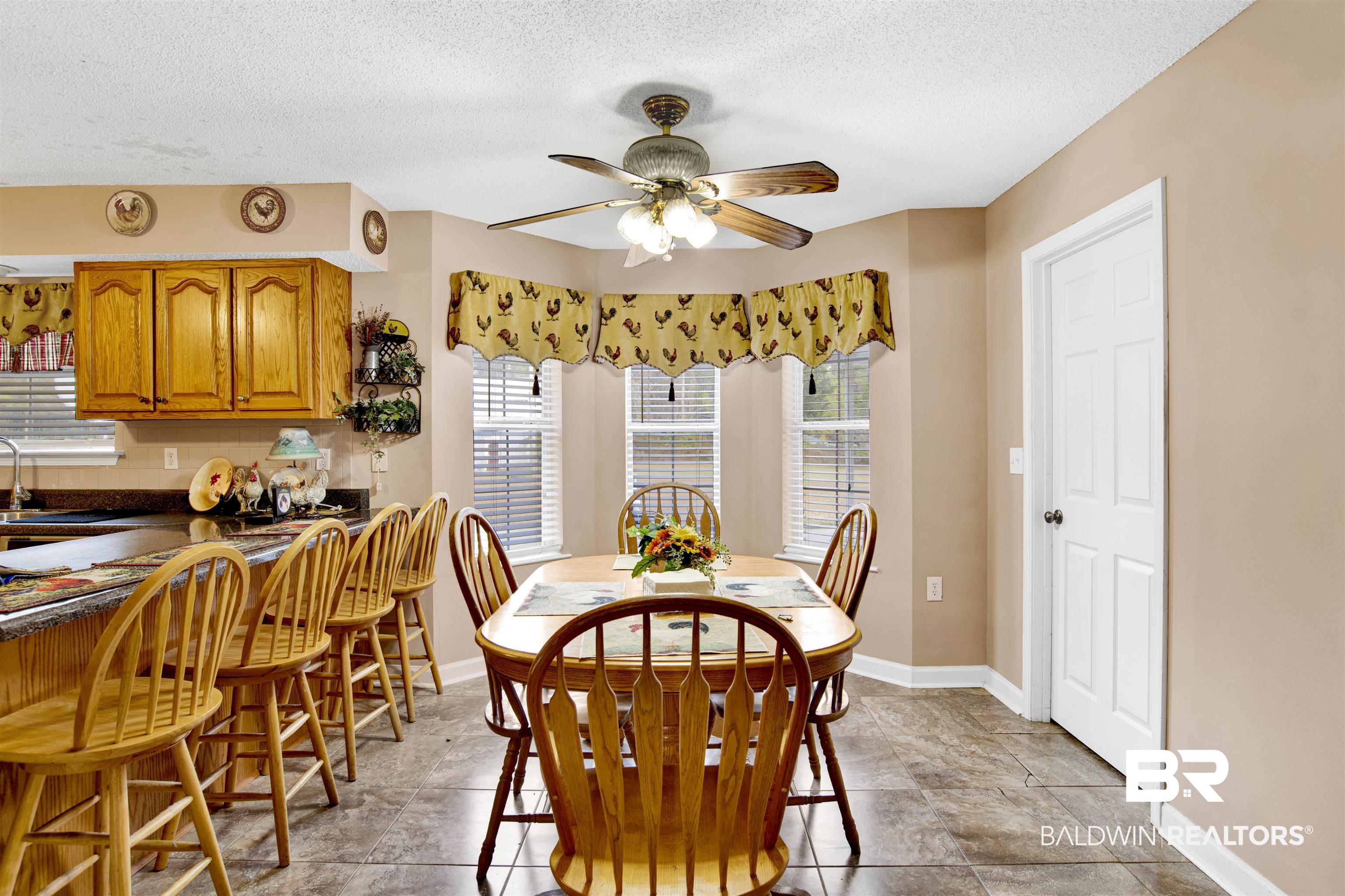 36434 Alexandria Trail Stapleton, AL 36578 - Photo 5 of 27 Dining space featuring a textured ceiling and a ceiling fan