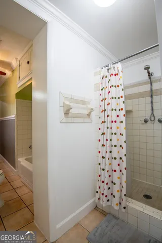 a bathroom with a shower and a sink