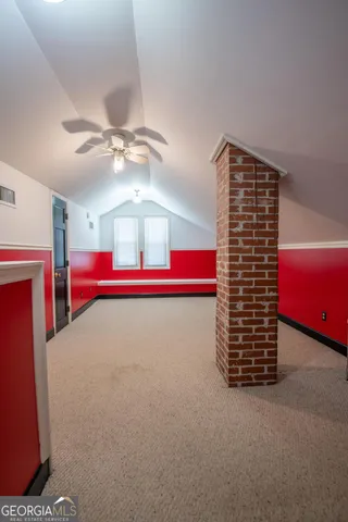 a room with pool table and chandelier