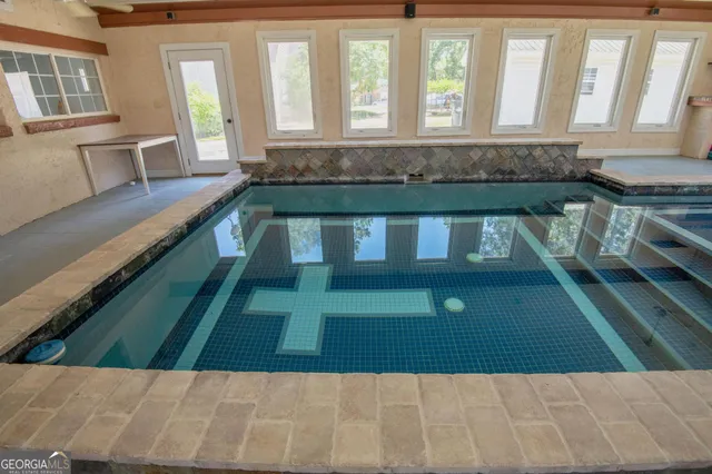 a kitchen with granite countertop a stove and a sink